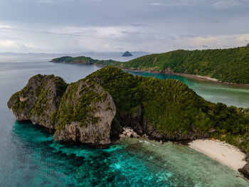 Scenic view of sea and rocks against sky