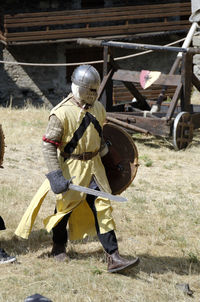 Full length of man standing on field