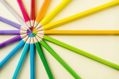 Close-up of multi colored pencils on table