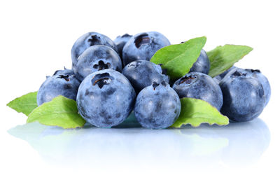 Close-up of fruits against white background