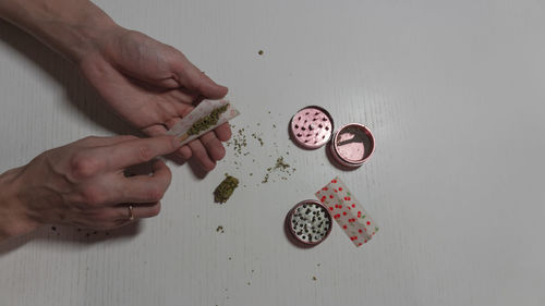 Midsection of person holding food on table