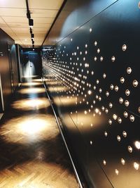 Illuminated lights on ceiling of building