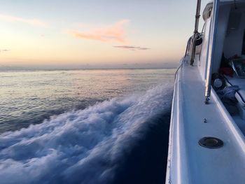 Close-up of sea against sky during sunset