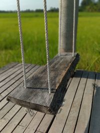 Close-up of swing in park