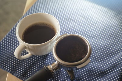 High angle view of coffee cup on table