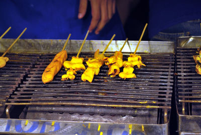 Yellow food on barbecue grill