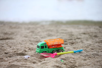 Close-up of toy car on sand