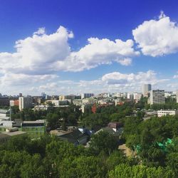 High angle view of city against cloudy sky