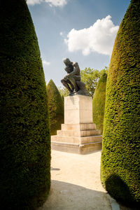 Statue of historic building against sky