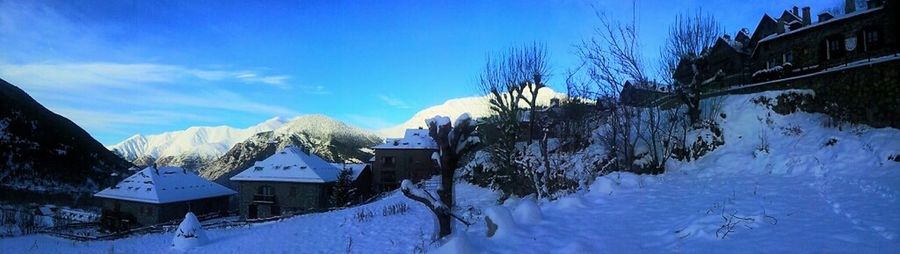 Scenic view of snow covered mountains against sky