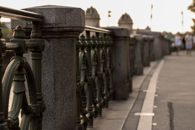 Balustrade by footpath in city