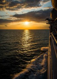 View of sea against cloudy sky during sunset