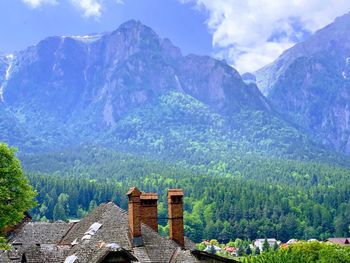 Scenic view of mountains against cloudy sky