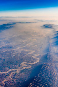 Aerial view of sea against sky during winter