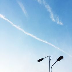 Low angle view of vapor trail against sky