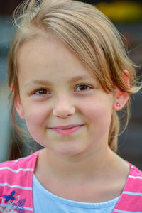 Close-up portrait of smiling girl