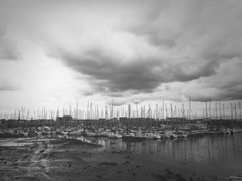 View of harbor against cloudy sky