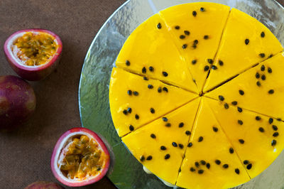 Directly above shot of passion fruit cheesecake on table