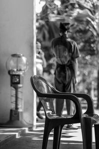 Midsection of man sitting on table