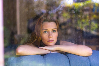 Portrait of young woman looking away