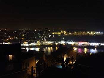 Illuminated cityscape at night