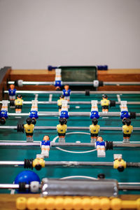 Close-up of figurines on foosball table