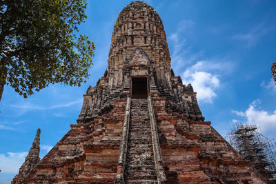 Low angle view of old temple building against sky