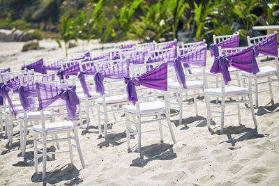 Empty chairs on beach