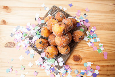 High angle view of food and confetti on table