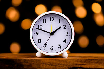 Close-up of clock on table