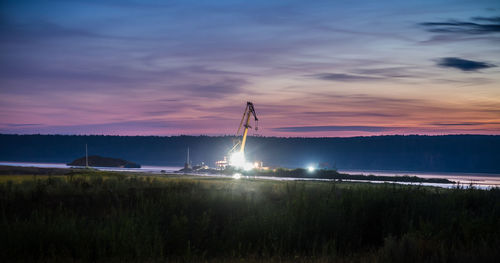 Scenic view of land against sky during sunset