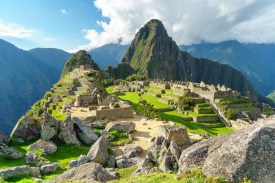 Scenic view of mountains against cloudy sky