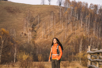 Rear view of man standing in forest