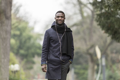 Portrait of smiling man standing outdoors