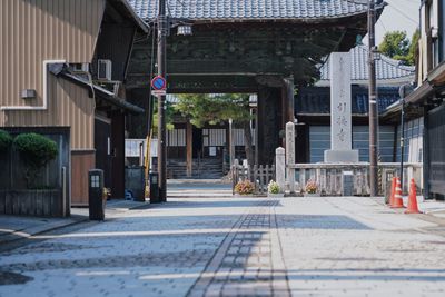 Road by buildings in city