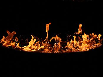 Close-up of bonfire against black background