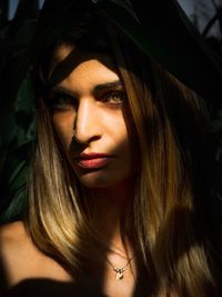 Portrait of young woman in sunny day