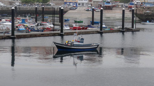 Boats moored in river