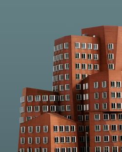 Low angle view of buildings against clear sky