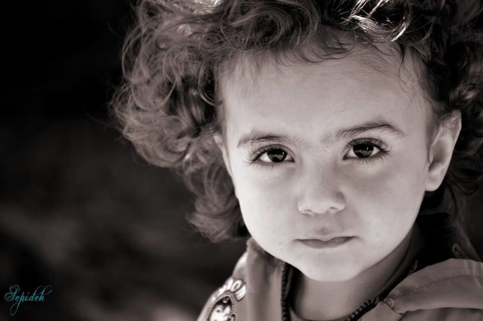 PORTRAIT OF YOUNG WOMAN WITH EYES CLOSED