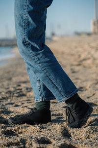 Low section of man on sand