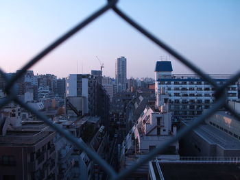 High angle view of buildings against clear sky