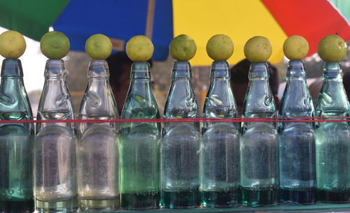 Close-up of lemons on bottles