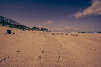 Scenic view of beach against sky during sunset