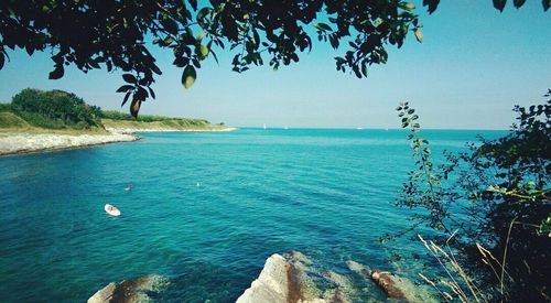 Scenic view of sea against blue sky