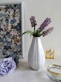 Close-up of flower vase on table at home