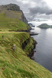 Scenic view of sea against cloudy sky