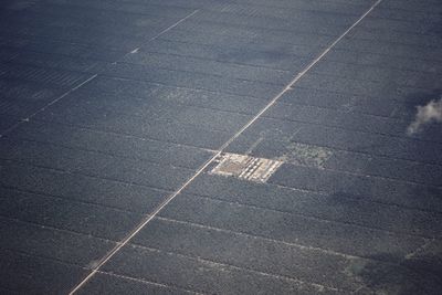 High angle view of arrow symbol on road