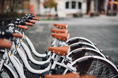 Close-up of bicycle parked on street in city