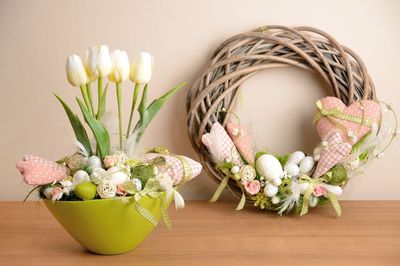 Potted plant in basket on table